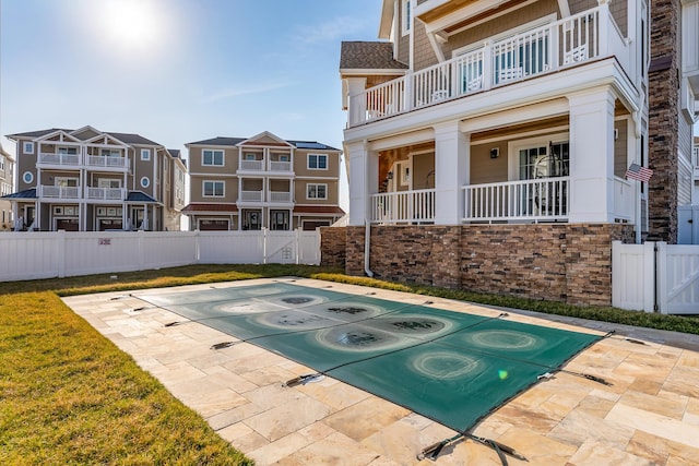 exterior space featuring a residential view and fence