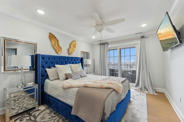 bedroom with visible vents, crown molding, baseboards, recessed lighting, and wood finished floors