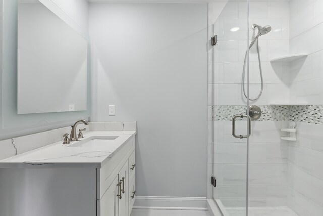 407 Paradise Way Unit 1, North Wildwood, NJ 08260 - bathroom with a stall shower, baseboards, and vanity