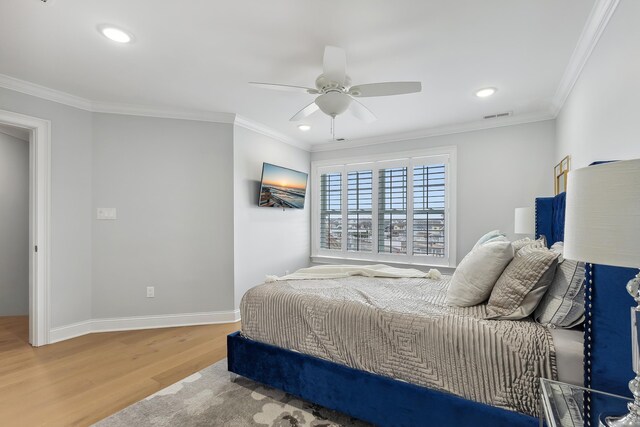 407 Paradise Way Unit 1, North Wildwood, NJ 08260 - bedroom with baseboards, ornamental molding, visible vents, and wood finished floors