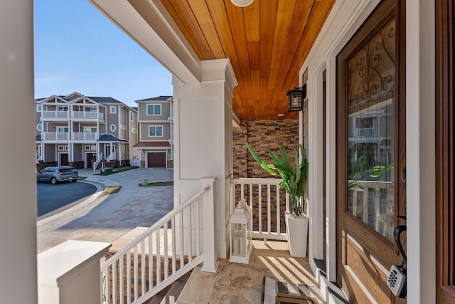 balcony featuring a residential view and covered porch