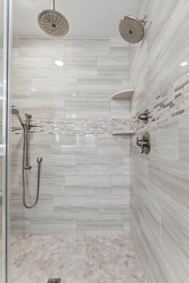 bathroom with a tile shower