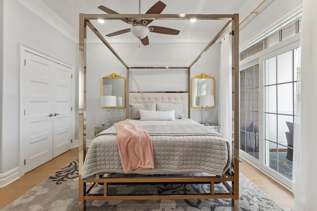 407 Paradise Way Unit 1, North Wildwood, NJ 08260 - bedroom featuring ornamental molding, multiple windows, ceiling fan, and wood finished floors