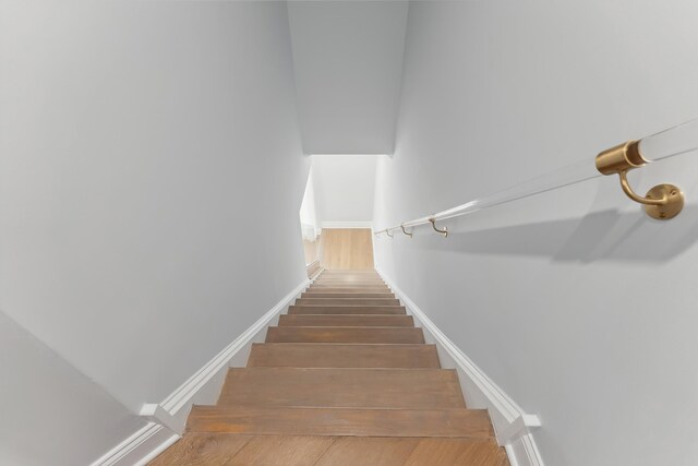 407 Paradise Way Unit 1, North Wildwood, NJ 08260 - stairs featuring baseboards and wood finished floors