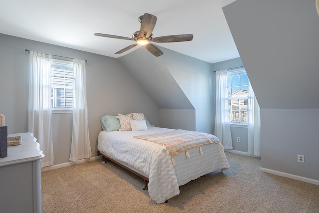 bedroom with baseboards, ceiling fan, lofted ceiling, and light colored carpet