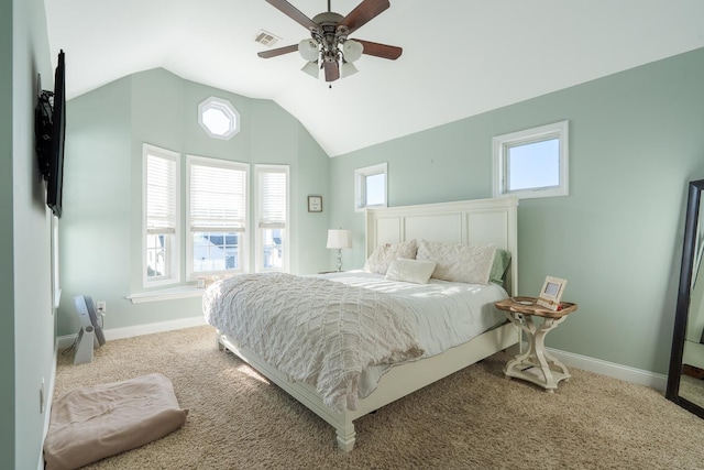 carpeted bedroom with lofted ceiling, a ceiling fan, visible vents, and baseboards