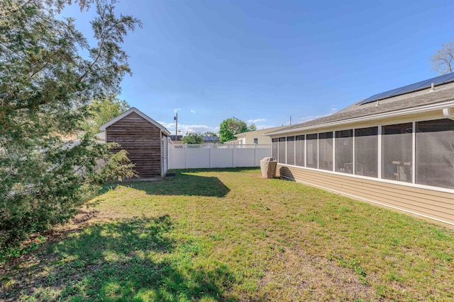 34 Holiday Rd, Villas, NJ 08251 - view of yard featuring a sunroom, a storage unit, and an outbuilding