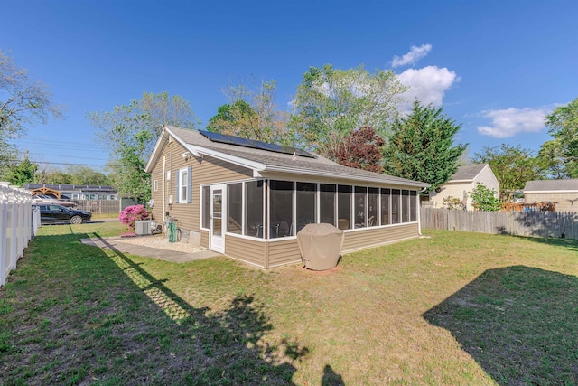 34 Holiday Rd, Villas, NJ 08251 - rear view of house with a sunroom, solar panels, central air condition unit, and a patio