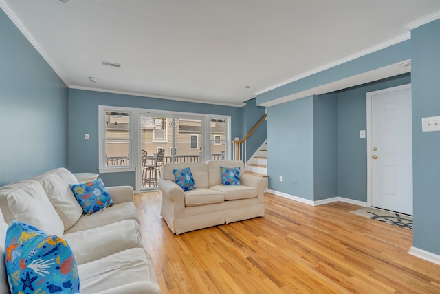 1520 Yacht Ave Unit 203, Cape May, NJ 08204 - living area with light wood finished floors, ornamental molding, baseboards, and stairs