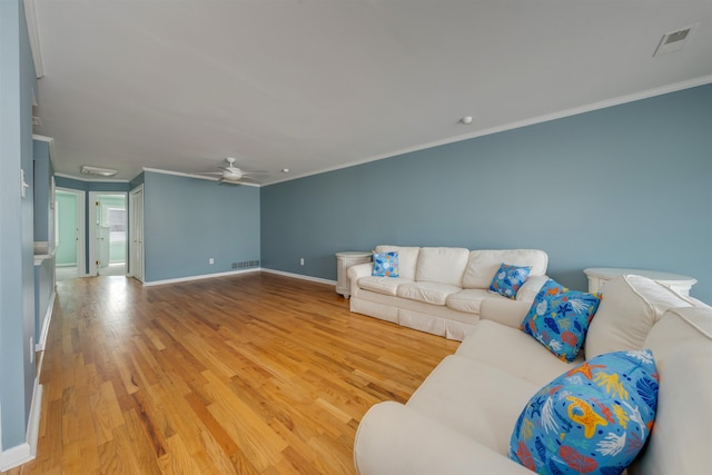 1520 Yacht Ave Unit 203, Cape May, NJ 08204 - living area featuring crown molding, light wood-style floors, baseboards, ceiling fan, and attic access