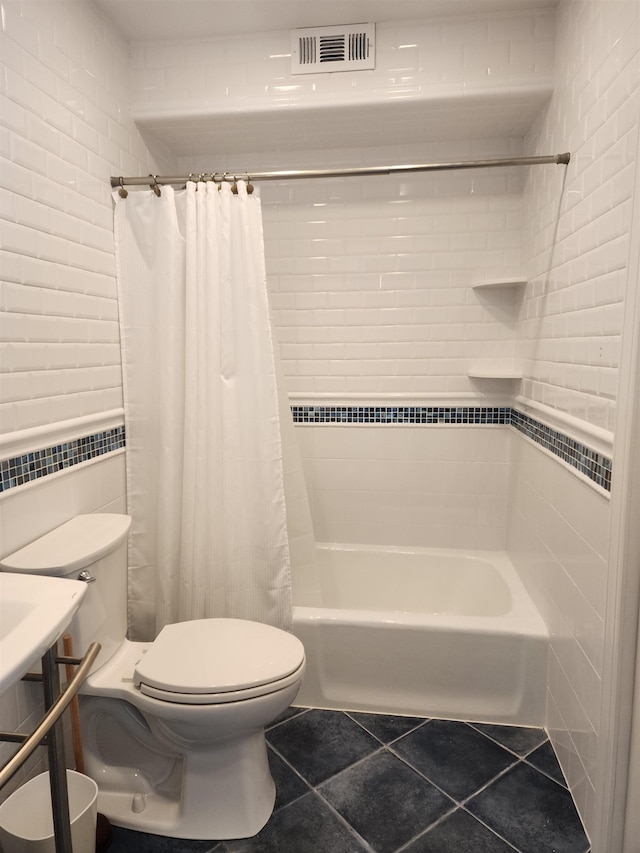 1520 Yacht Ave Unit 203, Cape May, NJ 08204 - bathroom featuring toilet, tile patterned floors, tile walls, and shower / bathtub combination with curtain
