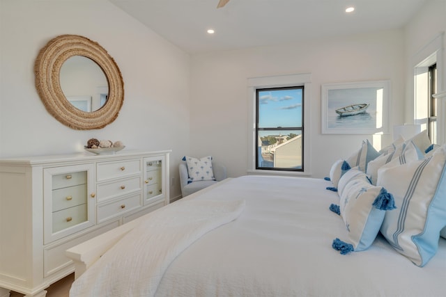 bedroom with multiple windows and ceiling fan