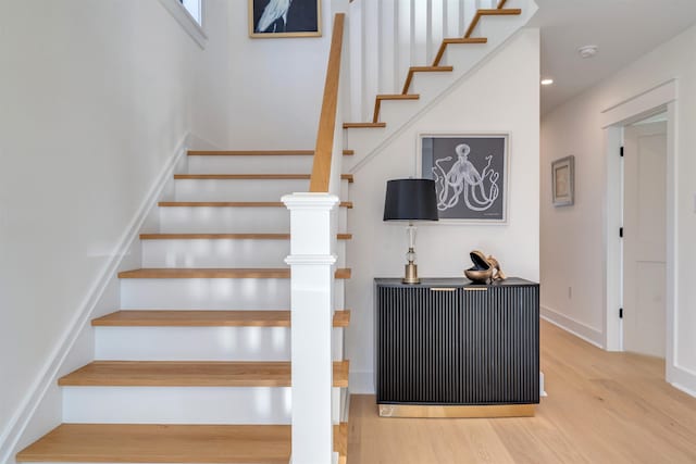 staircase with wood-type flooring