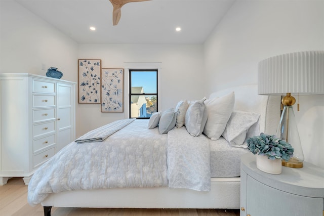 bedroom with hardwood / wood-style floors