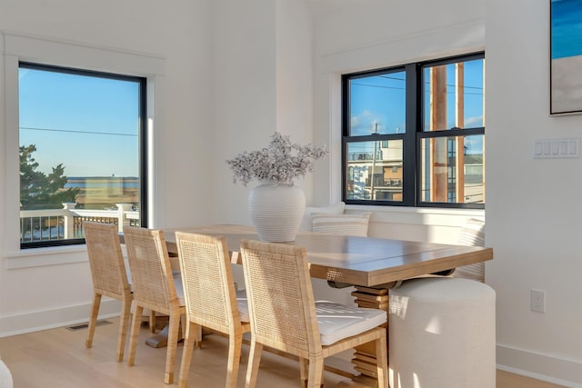 dining space featuring wood-type flooring