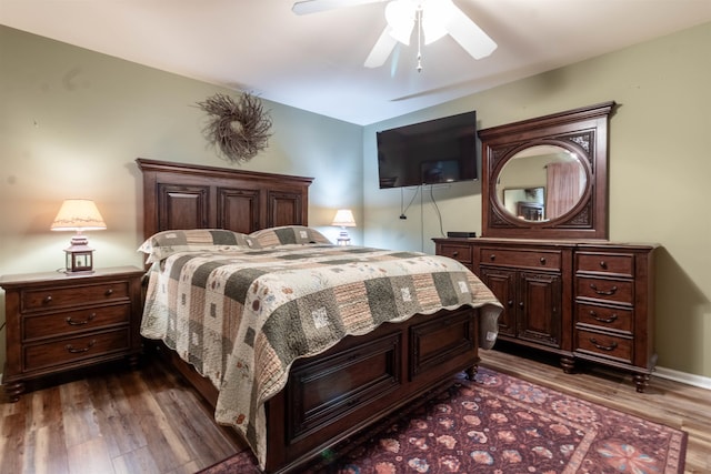 bedroom featuring dark wood-type flooring and ceiling fan