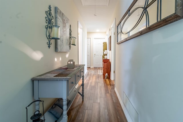 hallway featuring hardwood / wood-style flooring