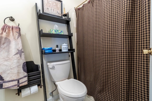 bathroom with toilet and curtained shower