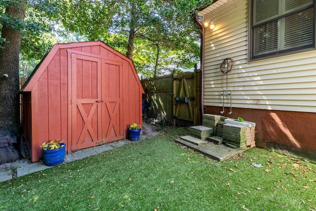 view of outdoor structure featuring a lawn