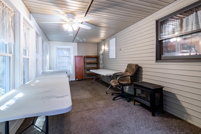 sunroom featuring ceiling fan