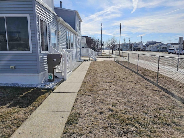 exterior space with a residential view and fence