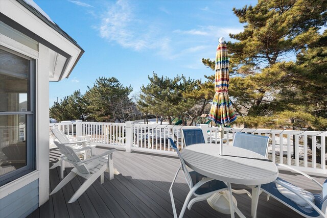 wooden terrace with a storage unit