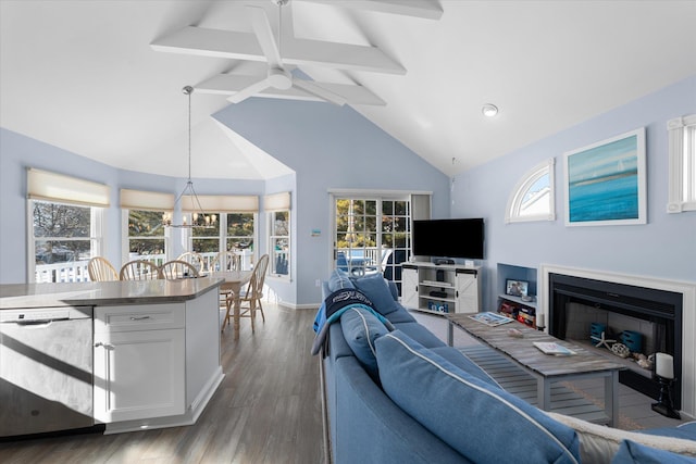 living room featuring ceiling fan with notable chandelier, dark hardwood / wood-style flooring, high vaulted ceiling, and beamed ceiling