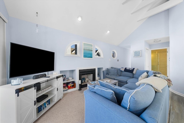 carpeted living room with lofted ceiling