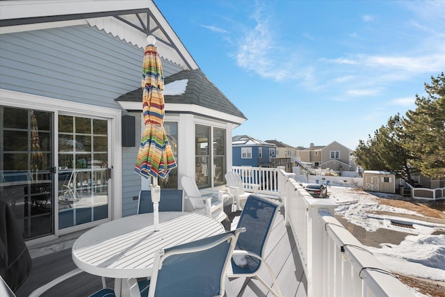 view of snow covered deck