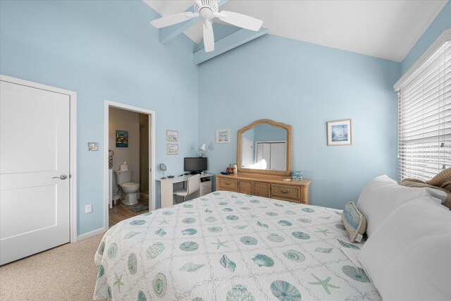 carpeted bedroom with ceiling fan, a closet, and high vaulted ceiling