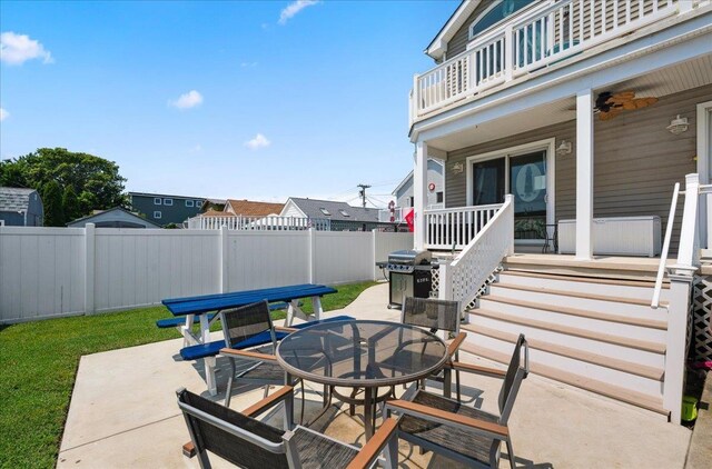 430 W Pine Ave, Wildwood, NJ 08260 - patio / terrace with outdoor dining area, a fenced backyard, a patio, grilling area, and covered porch
