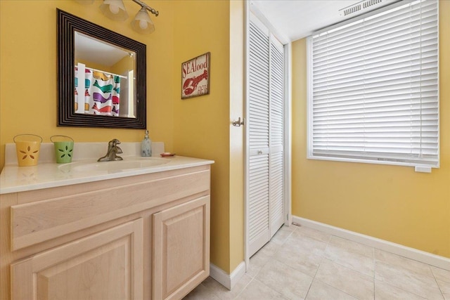 430 W Pine Ave, Wildwood, NJ 08260 - bathroom with a closet, vanity, and tile patterned floors
