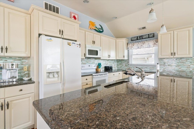 430 W Pine Ave, Wildwood, NJ 08260 - kitchen with white appliances, vaulted ceiling, backsplash, and pendant lighting