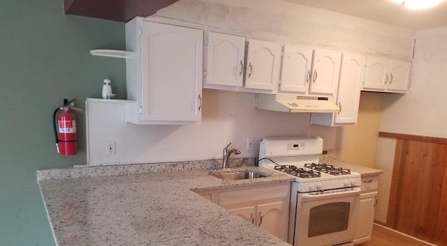 1964 E Oak Rd Unit O1, Vineland, NJ 08360 - kitchen with white range with gas cooktop, under cabinet range hood, white cabinets, and light stone counters