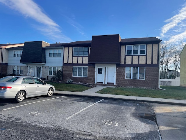 1964 E Oak Rd Unit O1, Vineland, NJ 08360 - view of front of property featuring uncovered parking, brick siding, a front yard, and roof with shingles