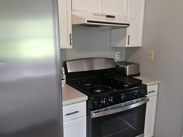 119 Hagen Rd, Clermont, NJ 08210 - kitchen featuring appliances with stainless steel finishes, under cabinet range hood, white cabinetry, and light countertops