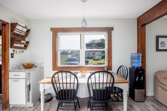 dining space with light wood-type flooring