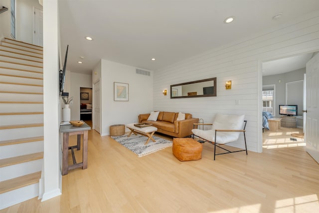 1524 Yacht Ave Unit A, Cape May, NJ 08204 - living area with stairway, light wood-style flooring, recessed lighting, and wood walls