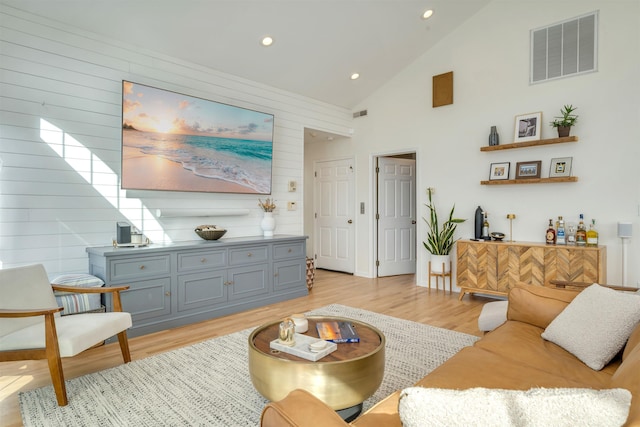 1524 Yacht Ave Unit A, Cape May, NJ 08204 - living area with light wood-style floors, wooden walls, recessed lighting, and high vaulted ceiling
