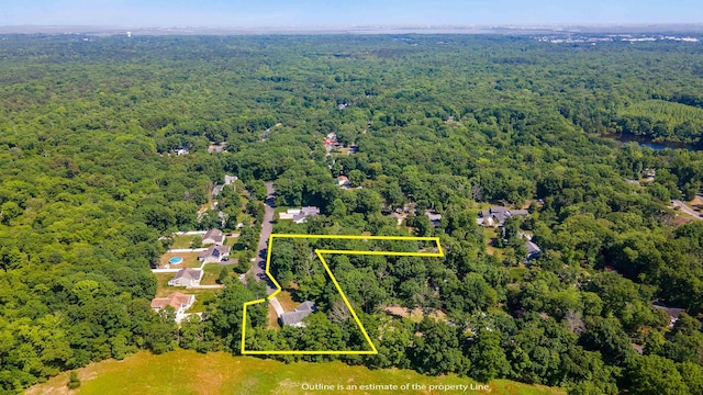 drone / aerial view with a view of trees