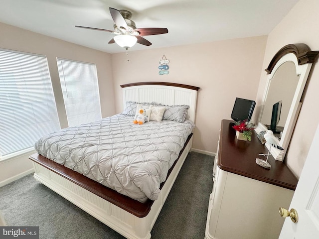 bedroom with ceiling fan and dark carpet