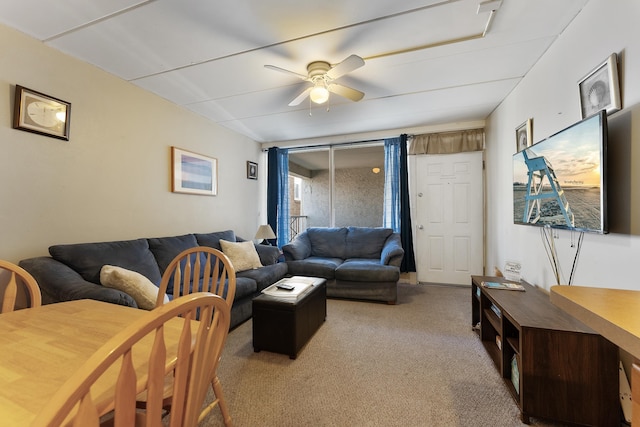 living room with ceiling fan and light colored carpet