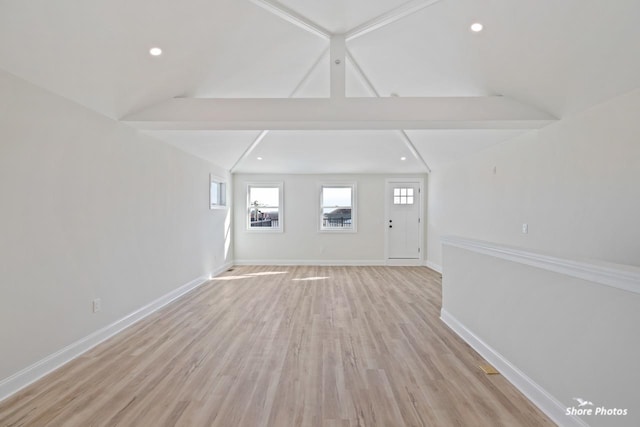 unfurnished living room featuring baseboards, light wood-type flooring, and recessed lighting