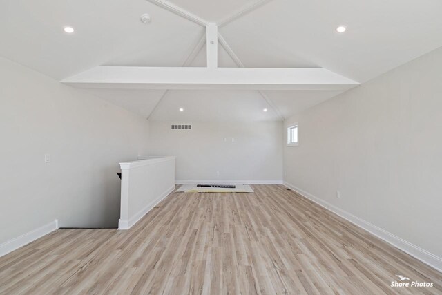spare room with baseboards, light wood-style floors, a smoke detector, and recessed lighting