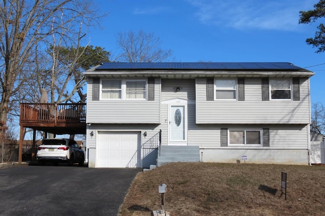 raised ranch featuring a garage