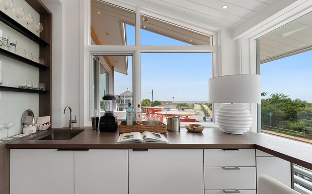 kitchen with white cabinetry and sink