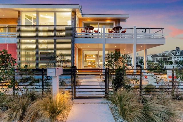 view of front of property with a balcony