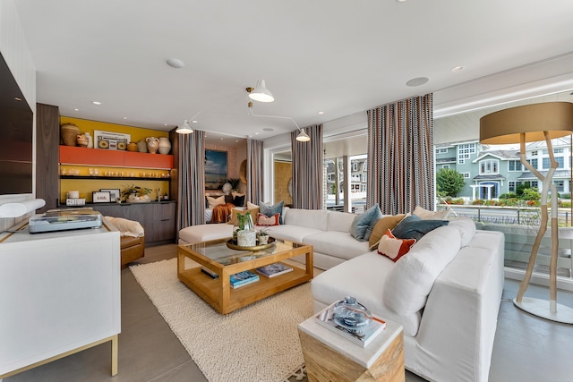 living room with concrete flooring