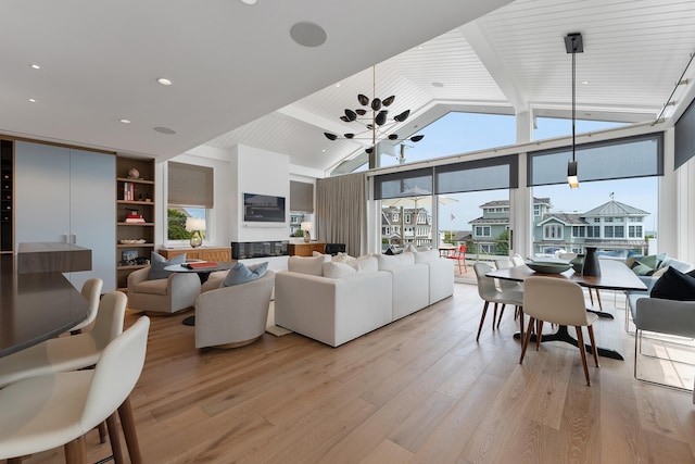 living room with wood ceiling, light hardwood / wood-style flooring, floor to ceiling windows, and beamed ceiling