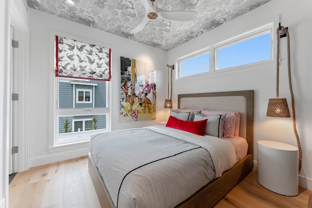 bedroom with light hardwood / wood-style flooring